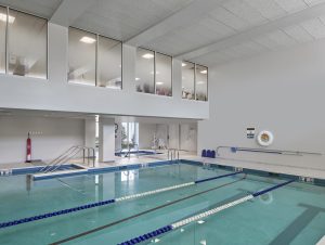 Fitness center overlooking pool